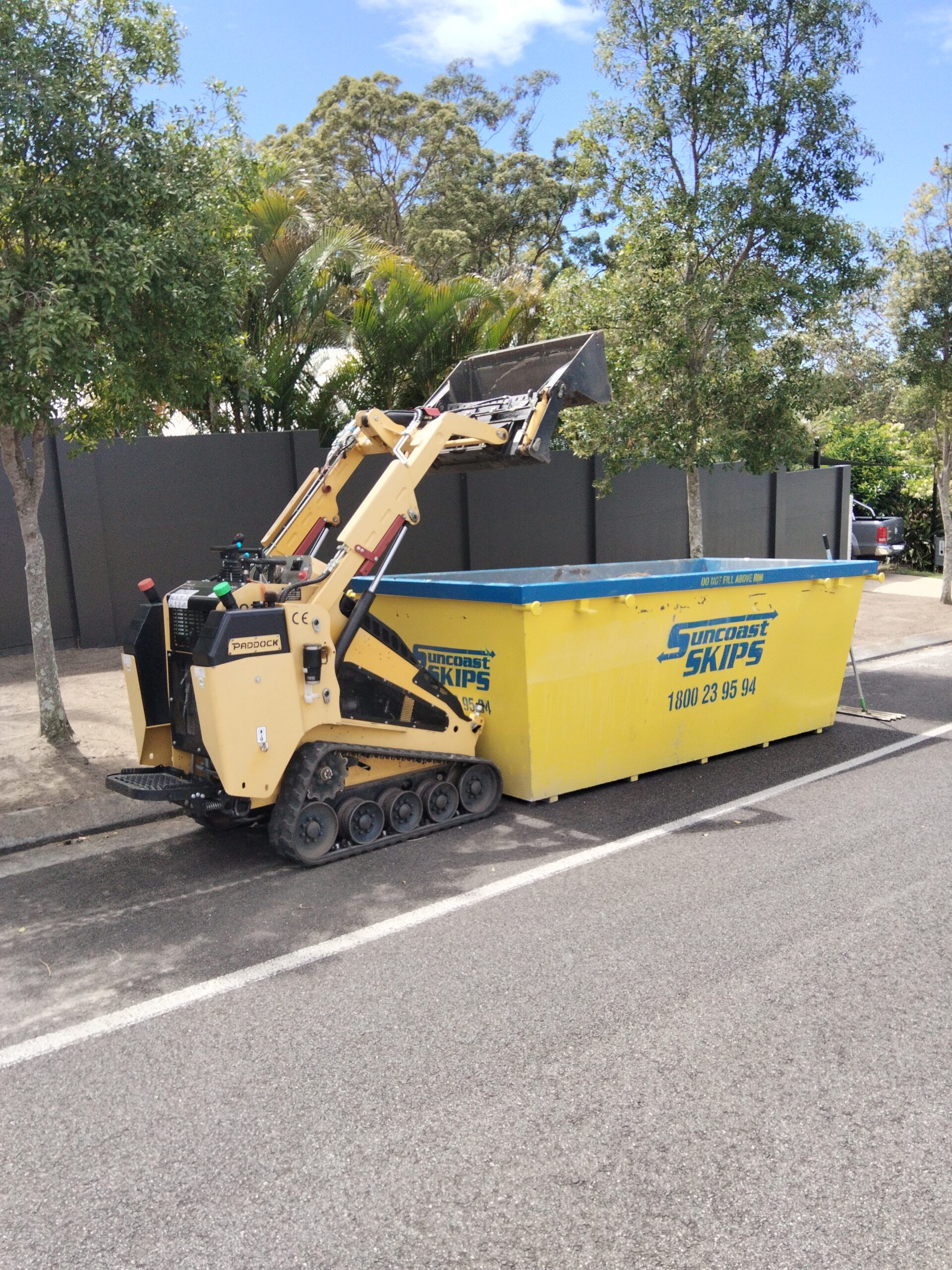 Paddock filling a skip bin